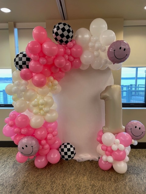 Pink smiley face first birthday balloon frame